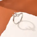 Silver letter U ring with pave cubic zirconia and round centerpiece on a stone base - Letter U Style