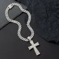 Macro shot of silver hip hop Cuban link chain and oversized iced-out cross pendant - Pendant And Cuban Chain / Silver