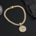 Macro shot of hip hop Eye of Horus pendant with blue stone and Cuban chain crystals - Pendant + Cuban Chain / Gold