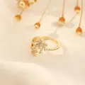 Macro detail of 18K gold plated open ring with zircon palm tree and starfish design - Coconut Tree & Starfish Design (Style C)