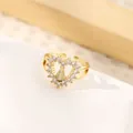 Detailed macro shot of an 18K gold-plated heart ring featuring a religious Virgin Mary icon - Heart-Shaped Virgin Mary Relief (Style E)