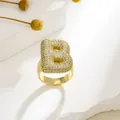 Detail of gold-plated letter B ring with micro-paved cubic zirconia stones and adjustable band - Letter B Style / Gold