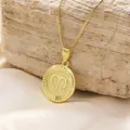 Macro detail of Aries zodiac coin pendant on gold plated box chain over stone - Aries