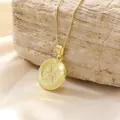 Detailed close-up of gold Pisces zodiac coin pendant on delicate box chain jewelry - Pisces