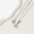 Detailed macro view of silver-plated letter A pendants with iced-out cubic zirconia stones - Letter A(A)