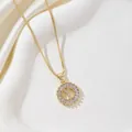 Gold letter Y pendant necklace with circular zircon stones on elegant white silk background - Letter Y