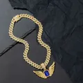 Golden hip hop chain with iced-out angel wings pendant and a blue center sapphire - Pendant + Cuban Chain / Gold