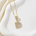 Elegant gold-plated letter D pendant necklace featuring shimmering cubic zirconia stones - Letter D