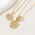 Gold-plated 'U' letter necklace featuring zircon-encrusted round halo and cubic stones - Letter U
