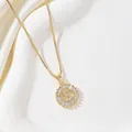 Close-up of golden letter S pendant with baguette-cut stones and box chain necklace - Letter S
