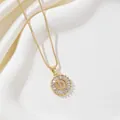 Macro detail of gold letter D pendant necklace featuring cubic zirconia micro-inlay - Letter D