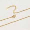 Close-up of gold-plated box chain with lobster clasp and adjustable extension chain - Box Chain / Gold