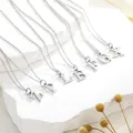 Classic silver-tone titanium steel initial pendant necklace on a stone background - Letter A / Silver