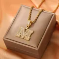 Luxurious 18K gold plated necklace featuring an iced-out letter M pendant with cubic zirconia - Letter M / Gold