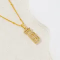 Gold letter B crown pendant necklace with micro-paved zircons on a white display - Letter B