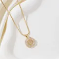 Golden necklace with letter U pendant featuring round and rectangular cubic zirconia - Letter U