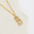 Golden crown initial D necklace with pavé cubic zirconia inlay on a thin gold chain - Letter D