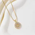 Golden round pendant necklace with letter W and sparkling cubic zirconia stones - Letter W