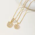 Two gold initial U necklaces with full pavé cubic zirconia pendants and unique chains - U Pendant And Necklace