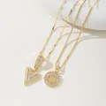 Dual 18K gold plated necklaces featuring zircon-studded letter V pendants and round medallions - V Pendant And Necklace