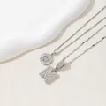 Silver-toned necklace with iced-out initial M pendant and clear cubic zirconia stones. - Letter M / Silver
