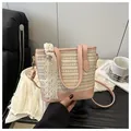 Detail of pink straw bucket bag featuring lace bow and woven texture details - Pink