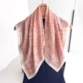 Close-up of pink orange cotton linen scarf with white paisley patterns and fine texture - Pink White Paisley Style (Style 21)