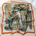 Square silk scarf with orange border and detailed feather print on white background - Orange Red