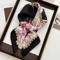 Detail of silk scarf with floral print and gold chain patterns on a luxury tray - Black Border Lily Chain Style (14)