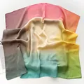 Detailed close-up showing the translucent texture and colorful gradient of the silk scarf - Green