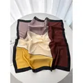 Silk-like square scarf featuring geometric color blocks in purple, yellow and brown - Black