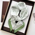 Elegant silk-like square scarf featuring green shell prints and sea star patterns - Light Green