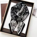 Detail of black and white paisley print silk scarf tied in a decorative tray - Black and White Paisley (6) / Black and White