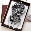Elegant geometric silk scarf with grey ring pattern in professional still life layout - Printed Square Scarf / Silver Gray Geometric (37)