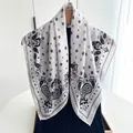 Elegant white paisley square scarf with black floral patterns and herringbone texture - White