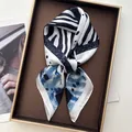 Navy blue and white zebra pattern silk scarf displayed on a luxury golden tray - Zebra Blue