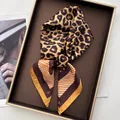 Elegant leopard print silk scarf with orange borders and star pattern for neck or hair - Leopard Brown