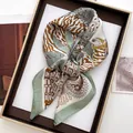 Detail of silk-like square scarf with leopard and palm patterns in a brown gift box - Large Square / Green Tropical Flora (25)