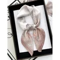 Elegant floral silk scarf in ivory and dusty pink tied as a stylish neckerchief - Lotus Pink