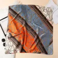 Elegant square silk scarf with vintage chain print in vibrant orange and blue tones - Orange Red