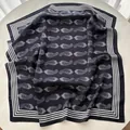 Close-up of silk scarf with classic black and white paisley pattern and striped borders - Dark Blue White Paisley (4)