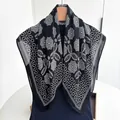 Elegant black and white floral linen cotton square scarf draped on a wooden hanger - Black White Geometric Floral Style (Style 20)