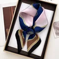Close-up of silk scarf with chain pattern and gold emblems in premium gift box - Vintage Chain Badge (14)