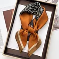 Elegant silk scarf featuring orange and black geometric patterns on a luxury tray - Caramel Black White Geometric Style (35)