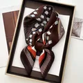 Close-up of floral silk square scarf with tulip pattern on a luxury display tray - Dark Coffee Tulip Twill Style (12)