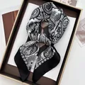 Vintage black and white paisley silk scarf displayed on a luxury display tray - Paisley Pattern / Black