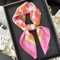 Luxury floral silk scarf in pink and orange floral pattern tied on a black display tray - Pink Orange Floral Yellow Green Stripe Style (31)