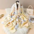 Detail of elegant floral silk scarf with vibrant flower prints on cream background - Light Yellow