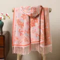 Detail of floral jacquard pattern and long tassel fringe on a thick winter pashmina shawl - Pink