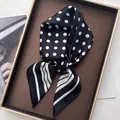 Elegant black silk scarf with white polka dots and stripes displayed on a luxury tray - 3-Sided Polka Dot Black